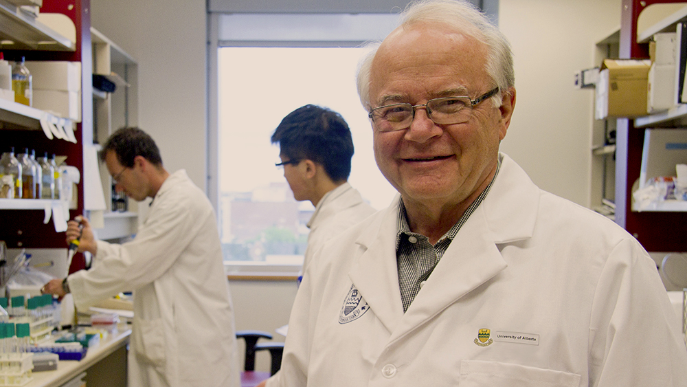 Lorne Tyrrell in the lab with students